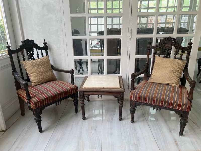 victorian style chairs with a table 0