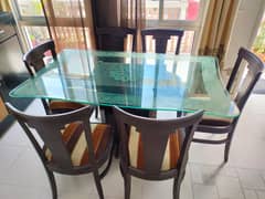 Glass Dining table with 6 wooden chairs