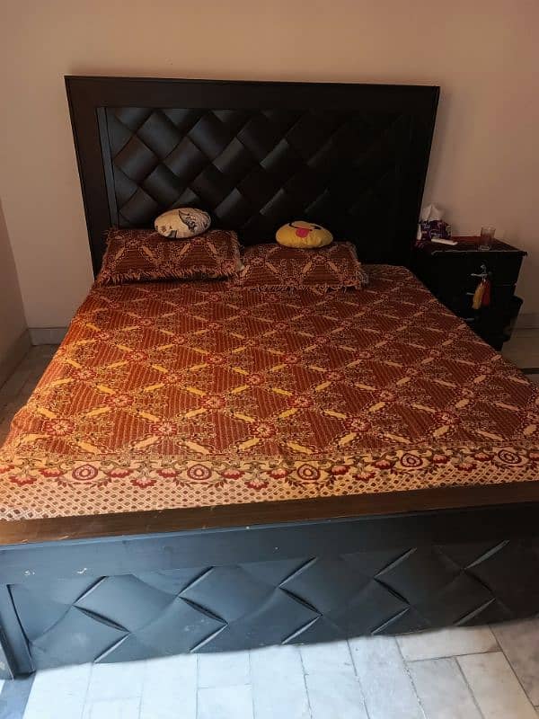 wooden bed side tables with a molty foam mattress 5