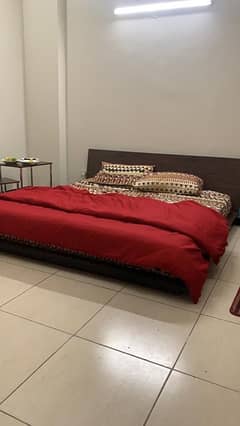 dark brown low profile king bed with side tables