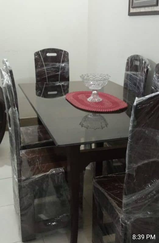 dining table with six chairs. only one week used 1