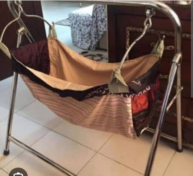 baby swing for sell condition in new colour is brown 2