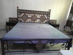 Iron bed with side tables and seater for sale