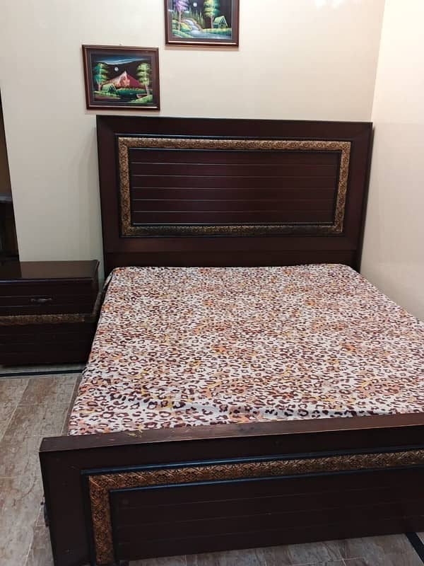 bed set with side table and dressing. . 0