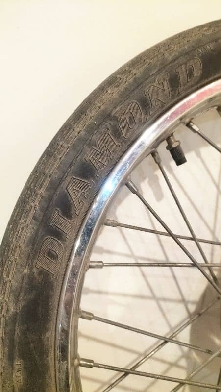 CD 70 front alloy rim and tyre 2