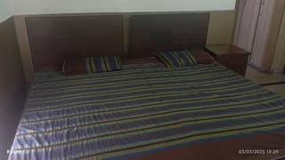 Single bed with mattress and side table