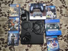 PS4 Slim 1TB – 2 Controllers, Charging Stand & 5 Games