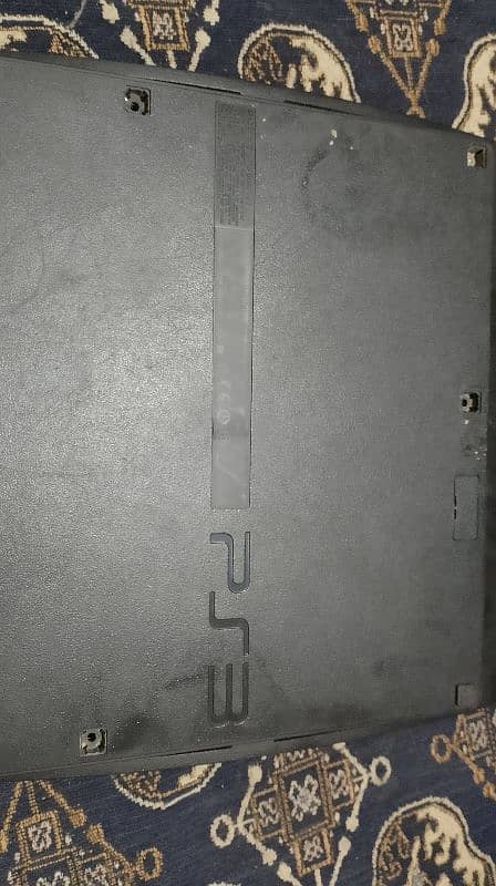 PS3 console + controllers + CDs 2