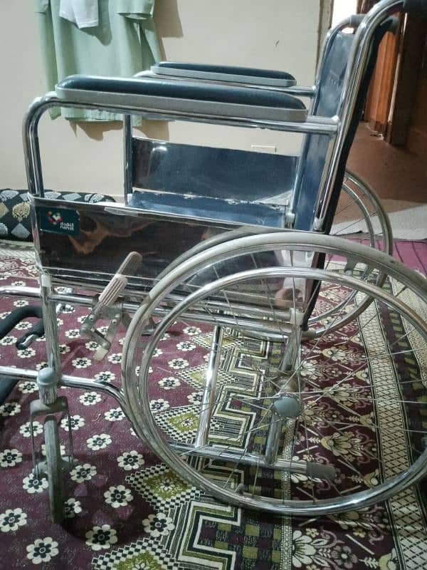 2 week used wheel chair 10/10 condition & foldable 1