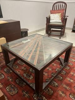 Artistic wooden table with glass top