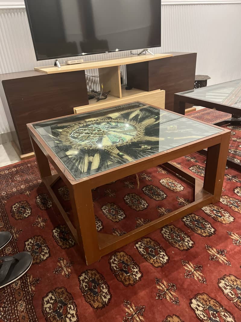 Artistic wooden table with glass top 1