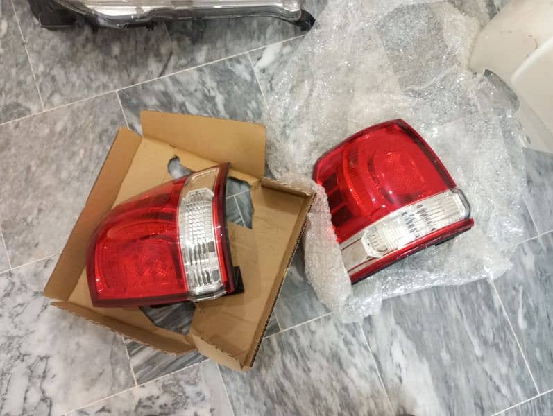 Land cruiser V8 headlights,back lights,side skirts ,bonut cover,grill 3