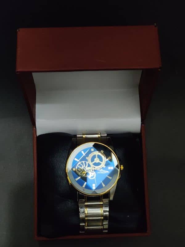 Elegance Horizon: Silver Watch with Blue Dial & Gold Accents 2