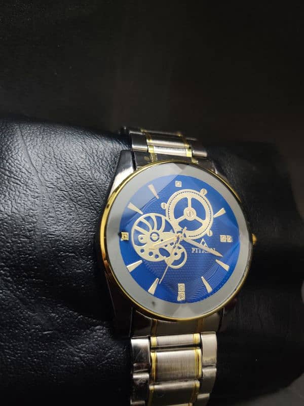 Elegance Horizon: Silver Watch with Blue Dial & Gold Accents 1