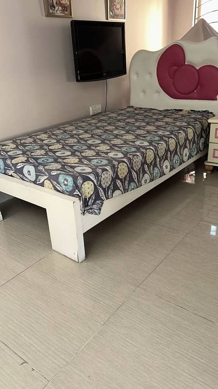 Single bed with a side table and mattress 4