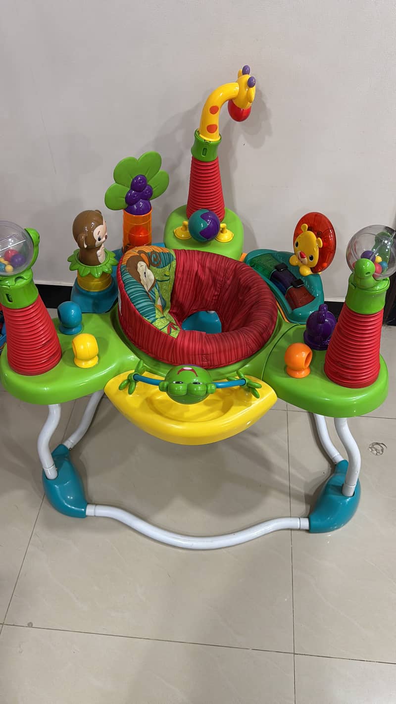 Bright starts revolving jumper with activity and sensory play 1