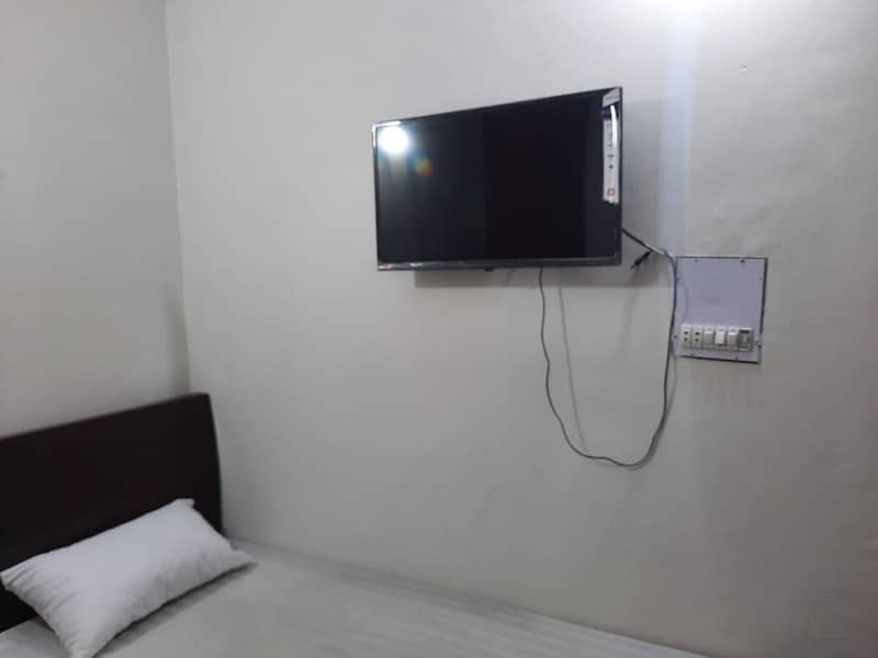 Furnished Independent LDA Flat/ Apartment with Carpeted 2 Rooms for Rent in Q Block Model Town Lahore with AC, Fridge, LED TV, Curtain, Stove, Beds, wood work, UPS, Tiled TV Lounge, Kitchen & bath room Rent = 32000 0