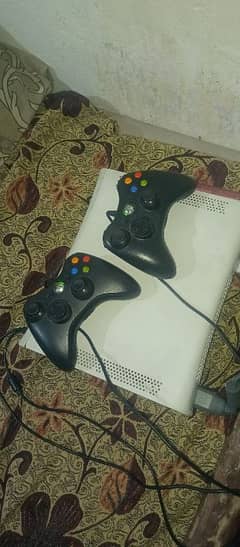 Xbox 360 with two controllers and asessories