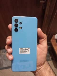 Samsung A32 with box amd charger 10/10 condition.