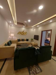 Two-bedroom fully furnished apartment with a lounge and kitchen fully furnished.