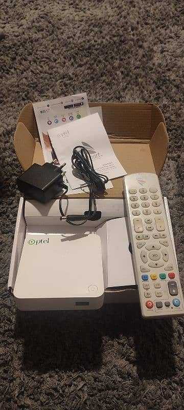 3 PTCL smart TV device with accessories and box 0