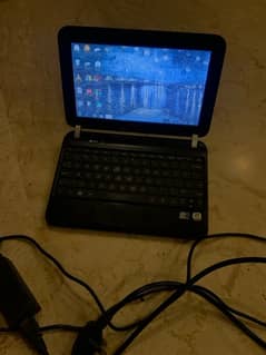 HP mini Laptop with Charger for sale.