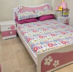 queen bed with 2 side tables andone dressing table