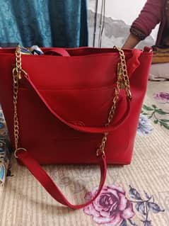 red hand bags