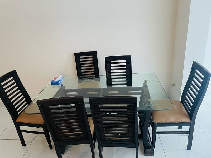 Six seater dining table set with glass top 4