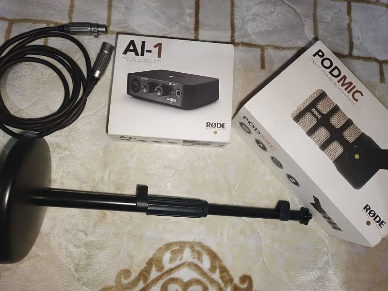 RODE Podcasting Bundle - PodMic, AI-1 Interface, Stand & XLR Cable 0