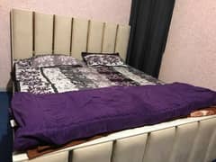 Slightly used King size bed for use with spring mattress