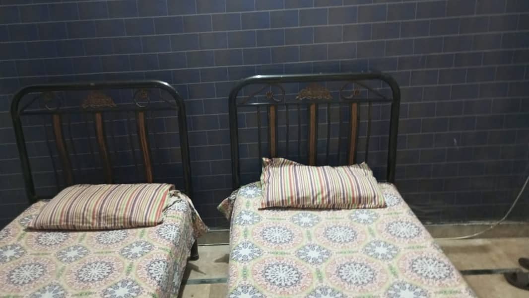 Two single iron Beds 1