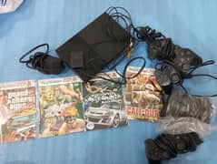 PS2 with games and controllers