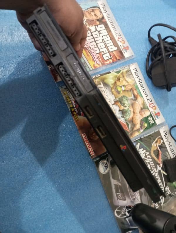 PS2 with games and controllers 3