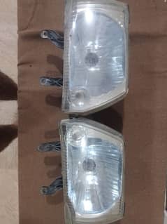 Original 100% Mehran euro 2 headlights pair , slightly used , very gud