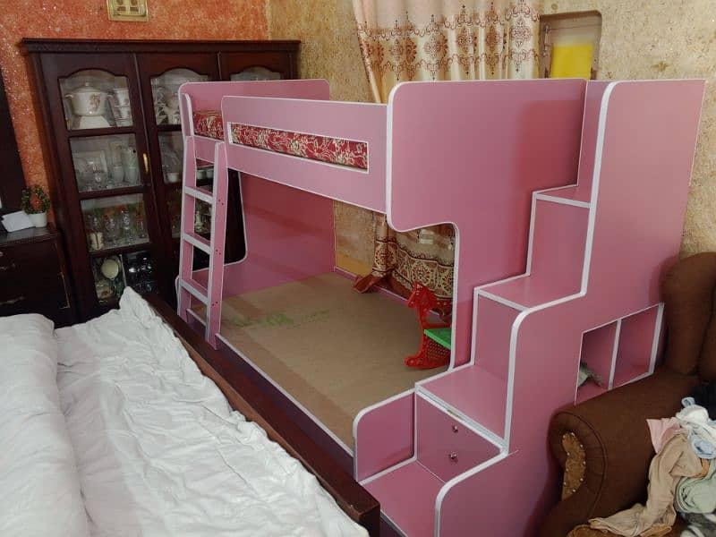 Brand new twin over bunk bed with built-in storage compartments. 0