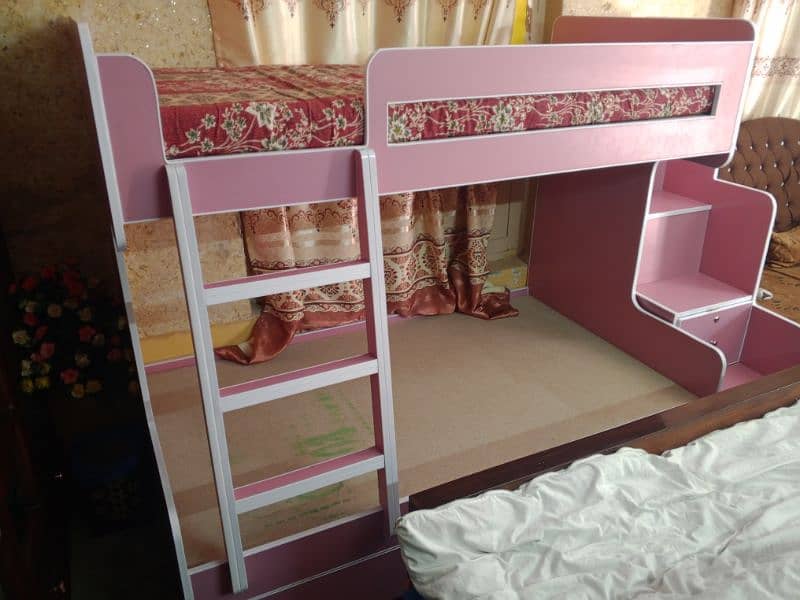 Brand new twin over bunk bed with built-in storage compartments. 1