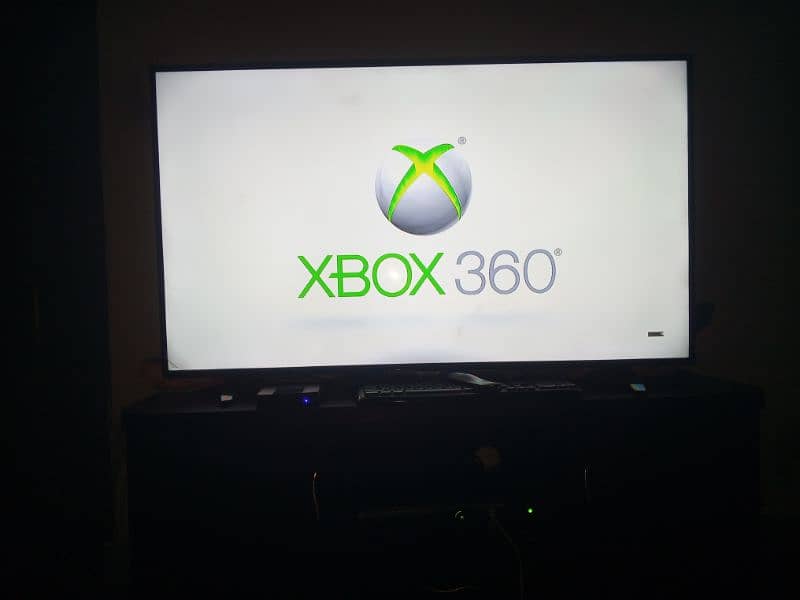 Xbox 360 with 21 games 1st hand price negotiable 12