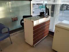 Counter with Glass Top and Revolving Chair