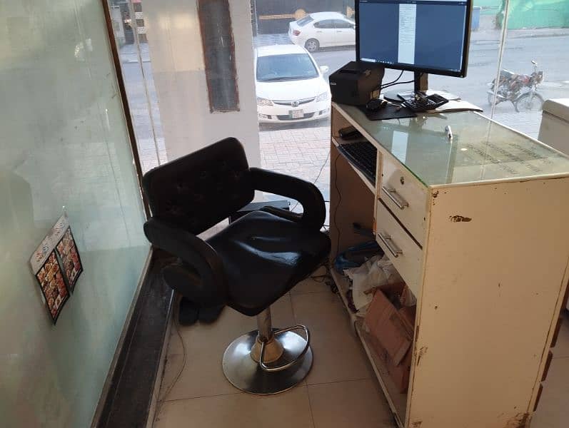 Counter with Glass Top and Revolving Chair 2