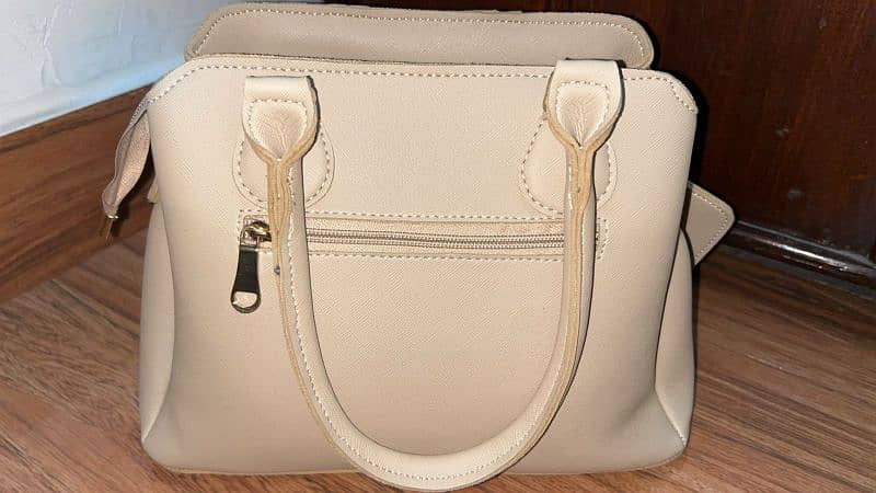condition is 10/10 urgently sale beige bag with 4 pockets 1