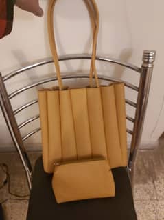 Stylish yellow hand bag in very good condition