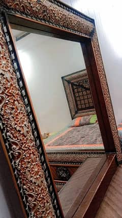 wooden bed with dressing