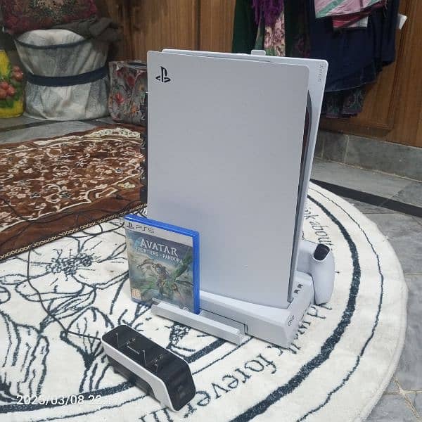 PS5 disk edition two controllers with stand plus charging station. 3