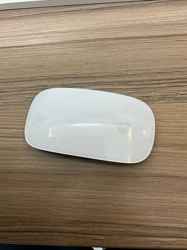 Apple Magic Mouse 3   Modle#: A1657 with books 3