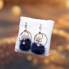 **Product Title:** Elegant Floral Hoop Earrings with Fur Pom-Poms  .