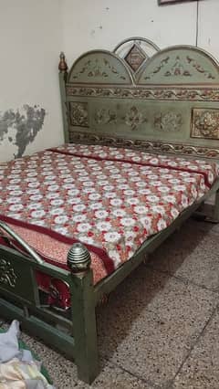 double bed with mattress and dressing table