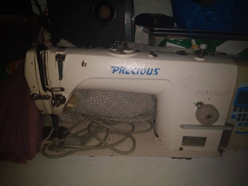 2 sewing machin sel 1 auto,1 manual oragi town 1