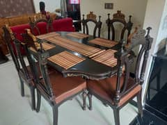 Chinioty dinning table with 6 chairs .