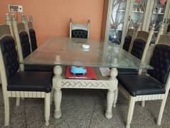 Dining Table with glass top and 8 chairs 2 head chairs